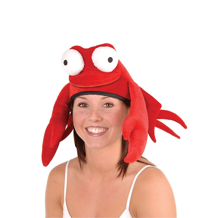 A women wearing a plush crab hat.