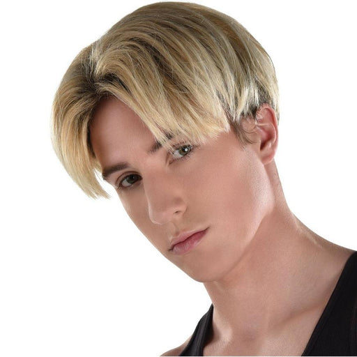 A man wearing a 90s Blond Heartthrob Bowl Cut Wig.