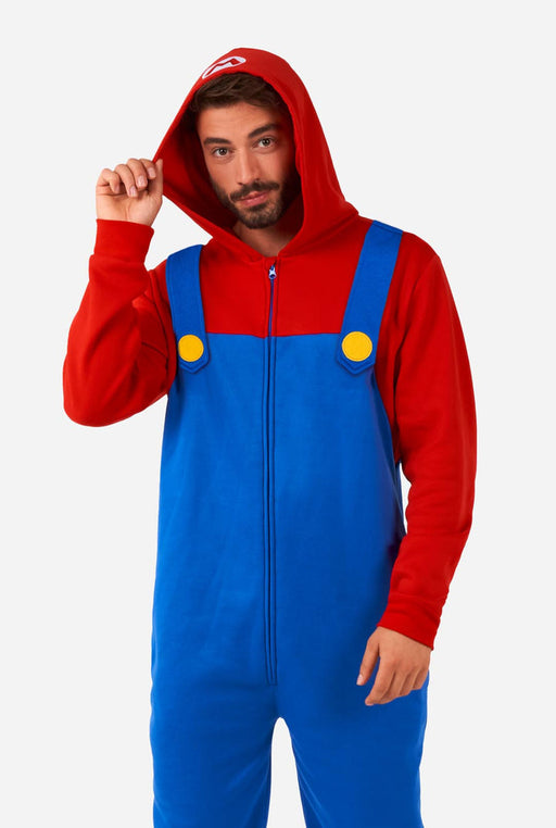 A man wearing an Adult Mario Onsie Costume.