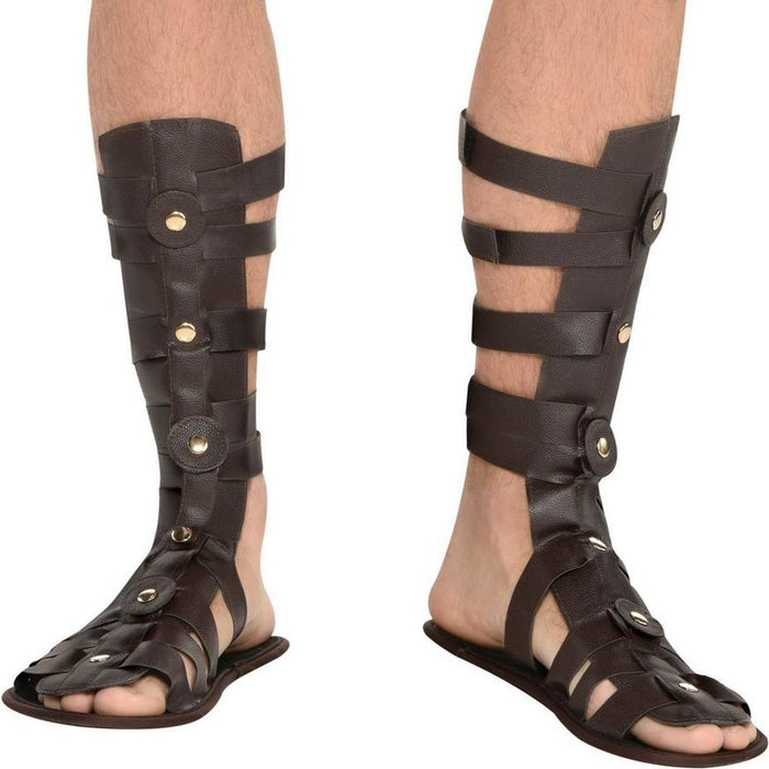 A man wearing a pair of Adult Brown Roman Gladiator Sandals.