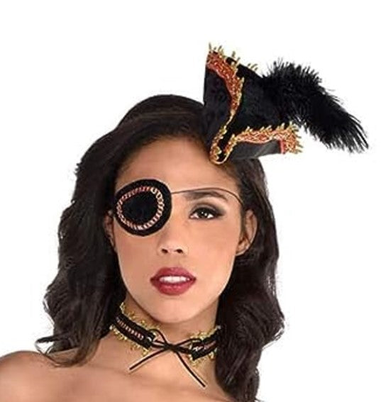 Ahoy, mateys! Arrrr ye ready to transform to a buccaneer beauty? Our Pirate Wench Kit has all ye need to embrace yer scurvy seafaring side! Outfit yerself with a headband, an eye-catching eyepatch, and a sea-worthy choker. Look sharp and be ready to sail the seven seas!