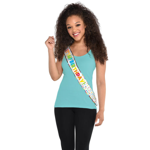 A photo of a women wearing a Birthday Celebration Fabric Sash.